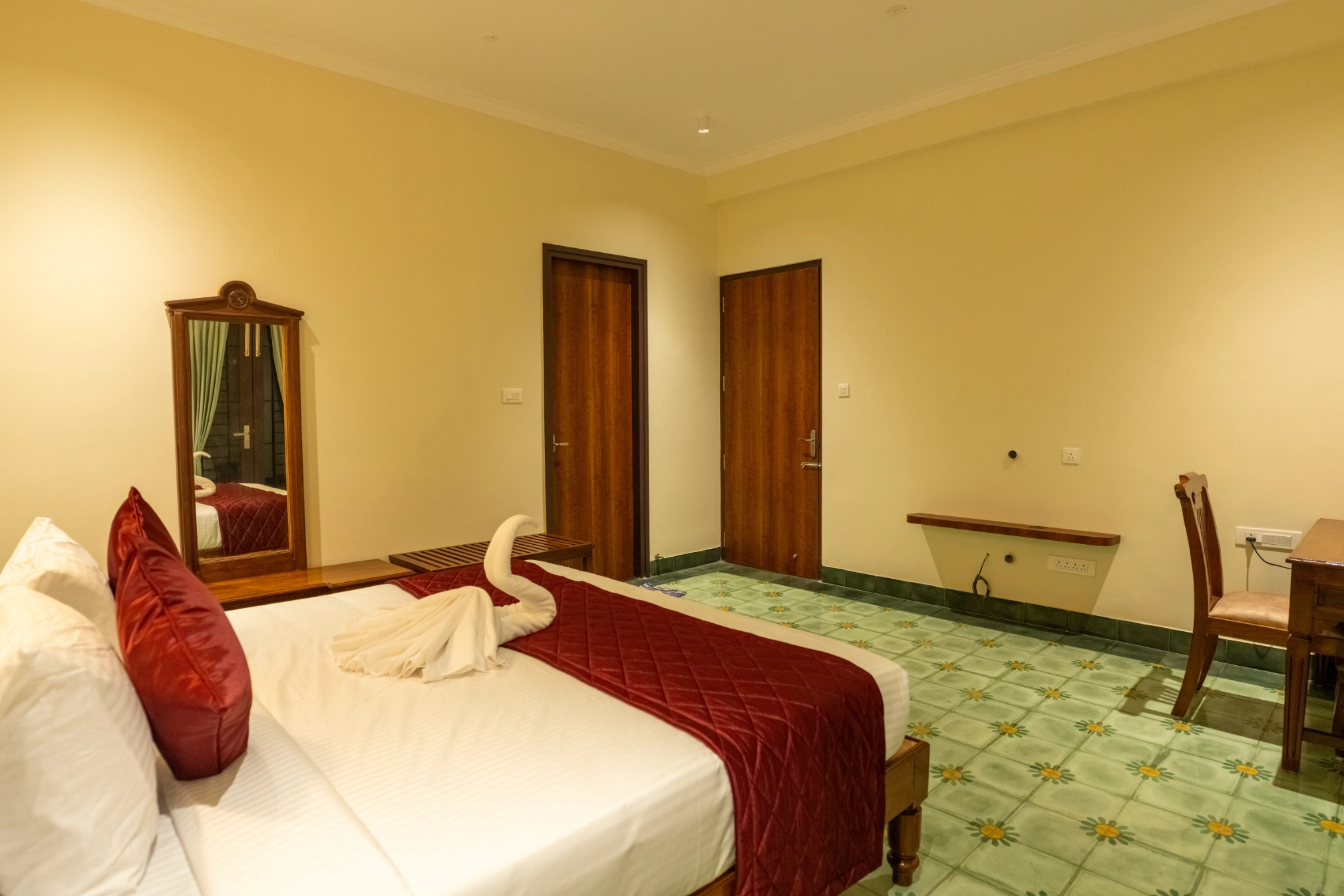 Luxury bedroom with king-size bed in Kumbakonam heritage villa